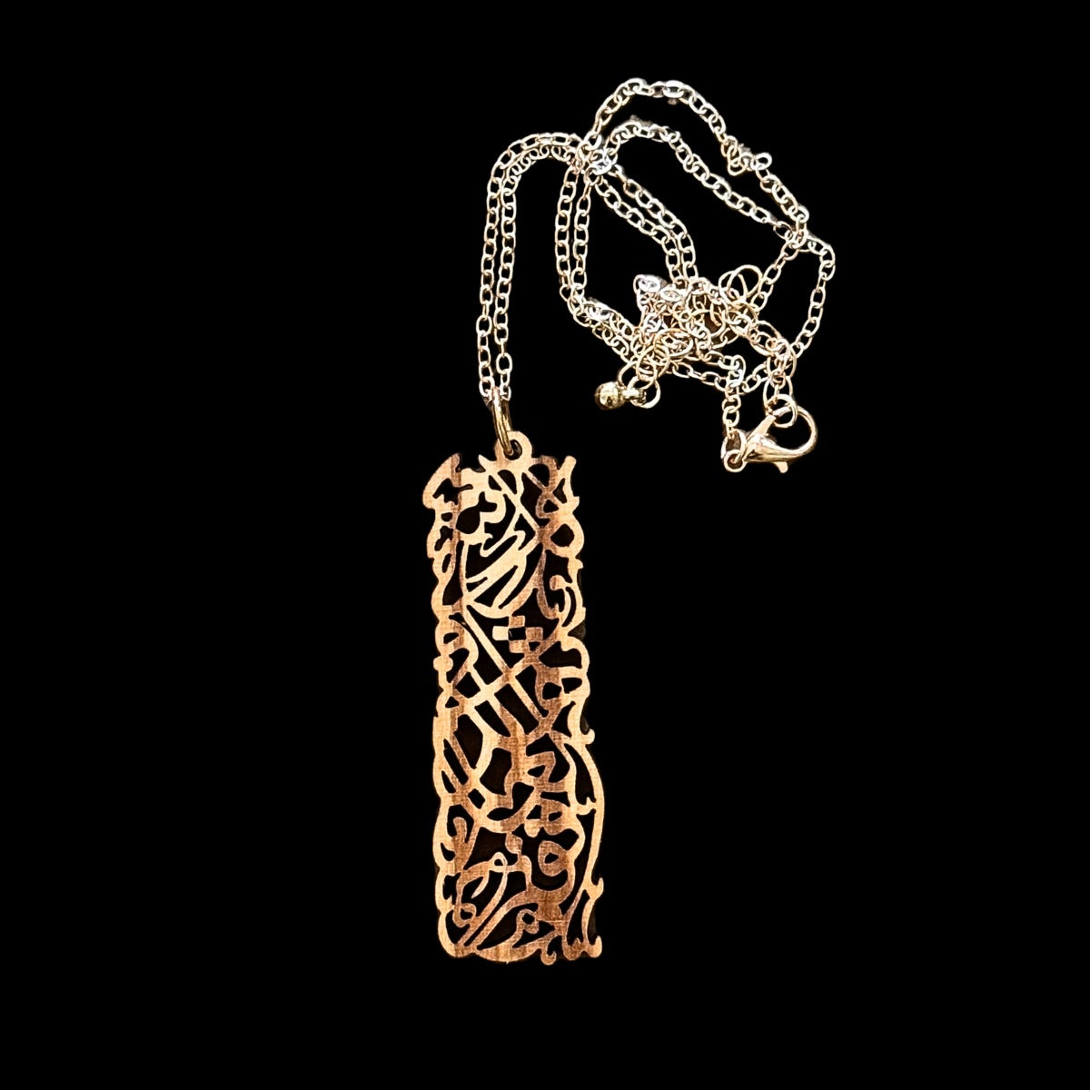 Olivewood Arabic Calligraphy Pendant "There is something for you..."